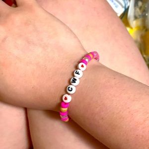 Can make costume bracelets!! this one has mine and my boyfriend’s baby’s initial